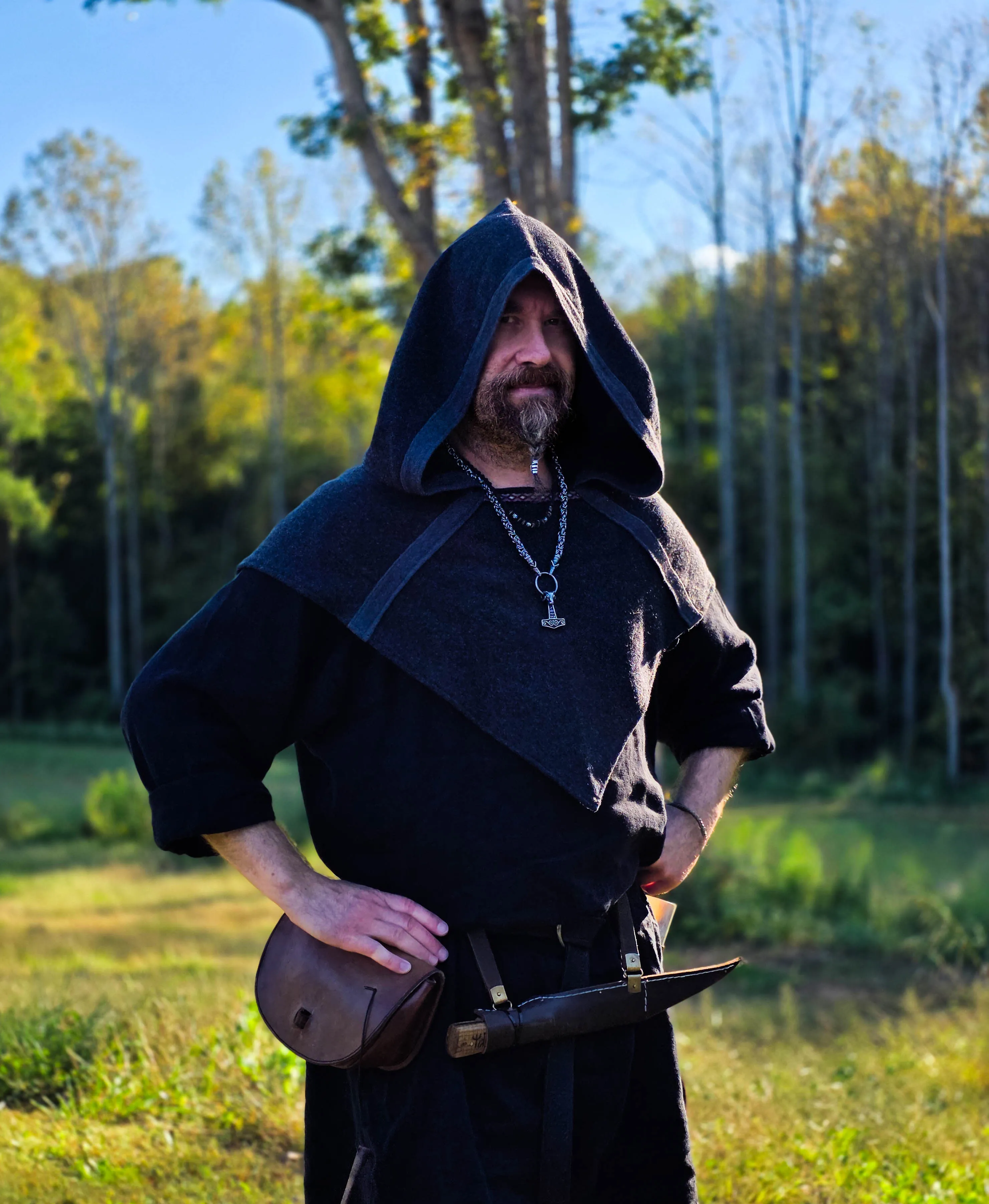 Smedis in Viking Age dress with a leather pouch and knife